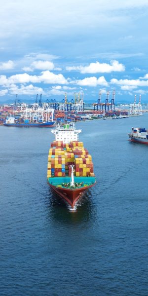 cargo maritime ship with contrail in the ocean ship carrying container and running for export