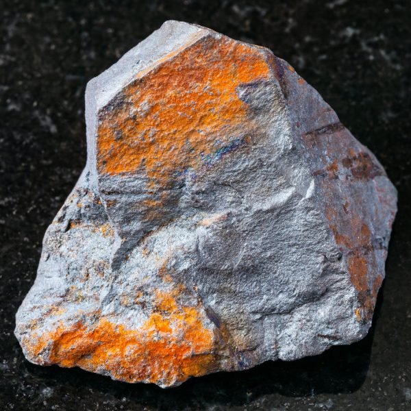 raw Hematite ore on black granite